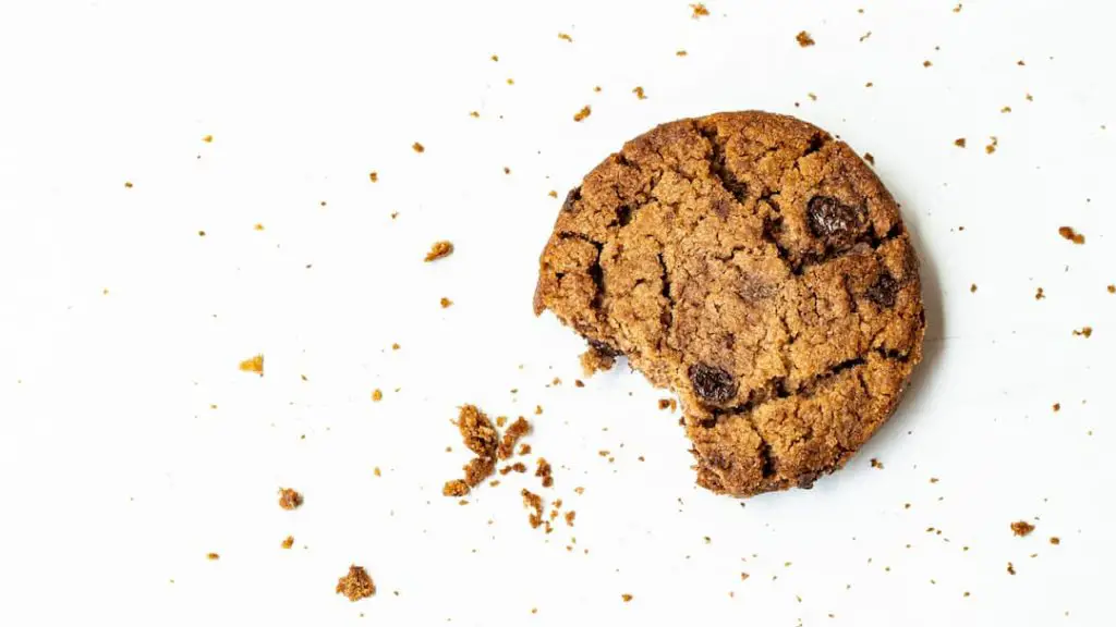 A chocolate chip cookie with a bite taken out of it