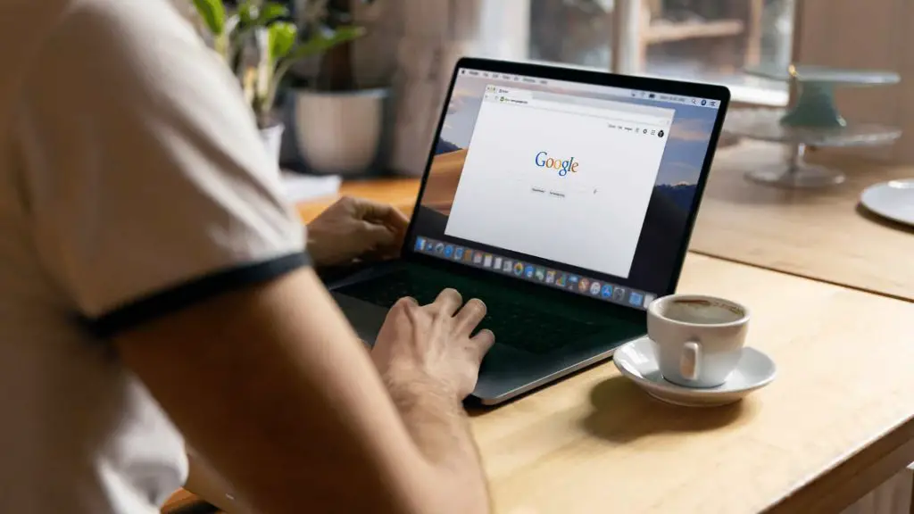 A person using Google on a laptop